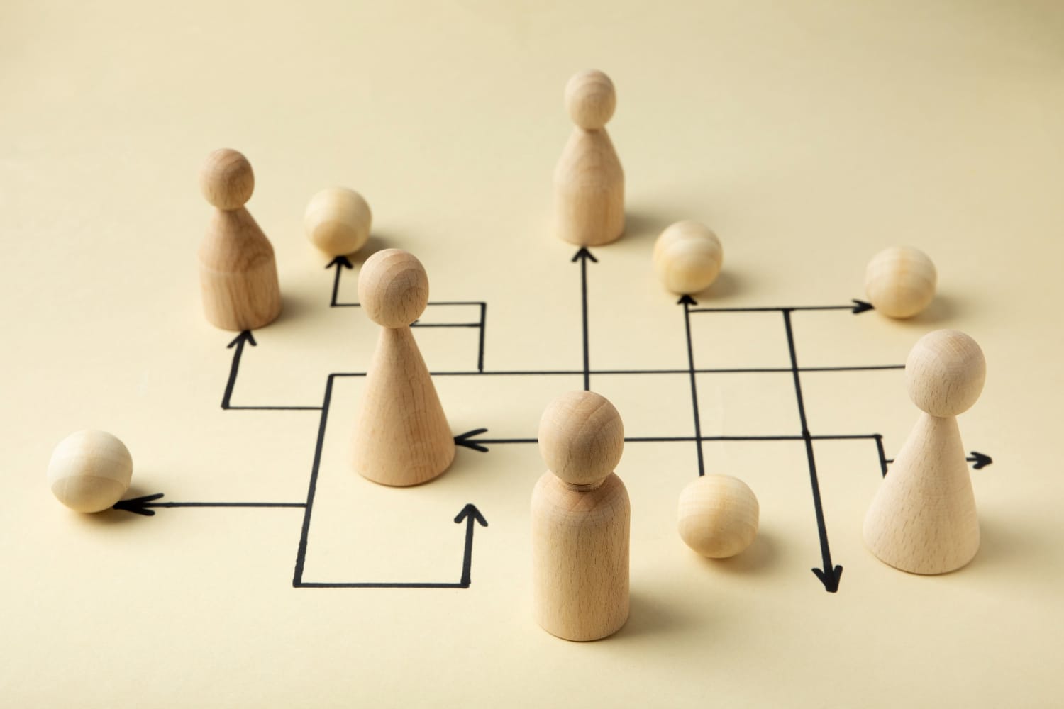 Wooden chess pawns arranged on a board, photographed from above