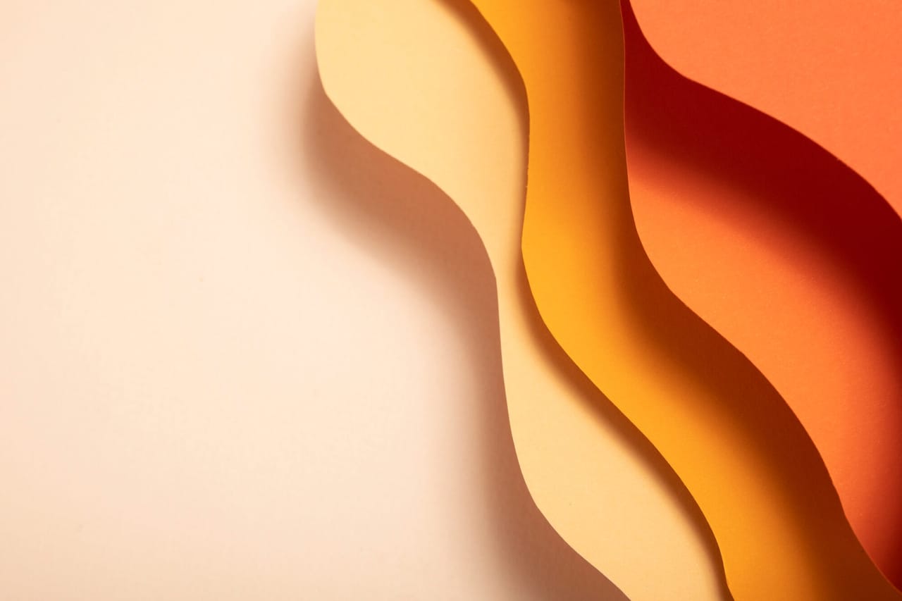 Layered paper shapes in warm tones